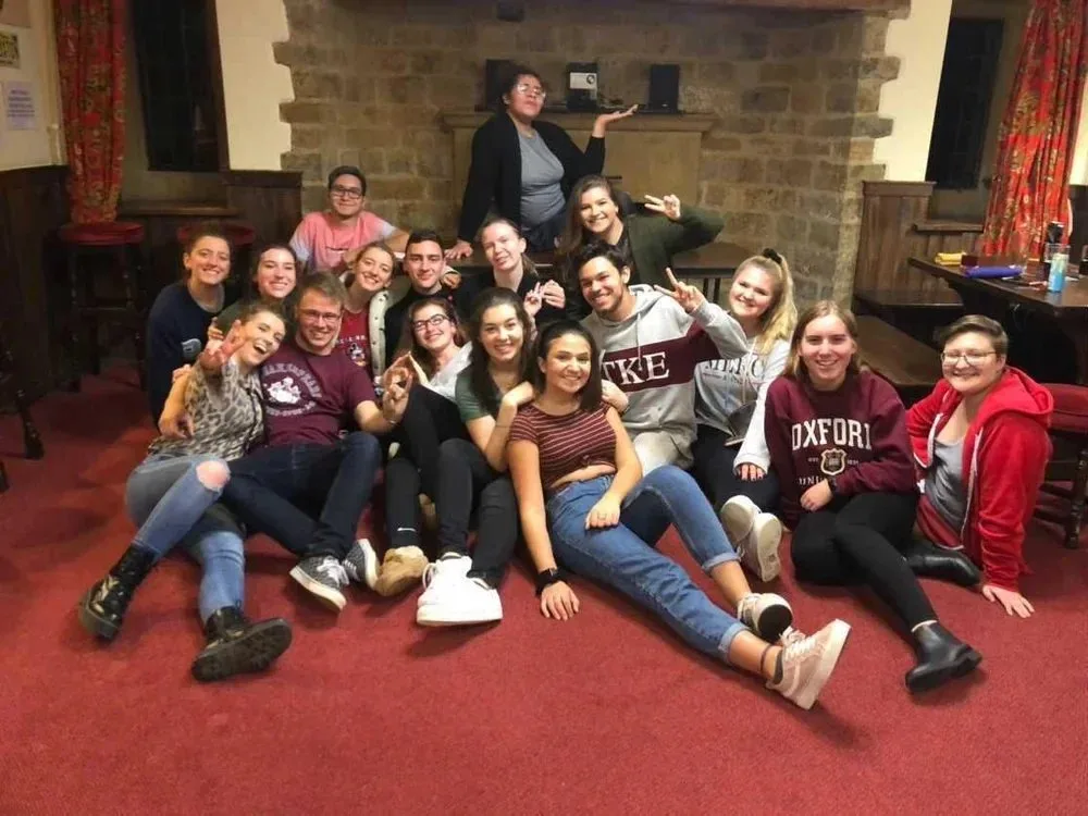 Students together in the Abbey common room in the evening